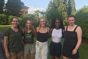 A group of Wheaton College students smile in Switzerland.